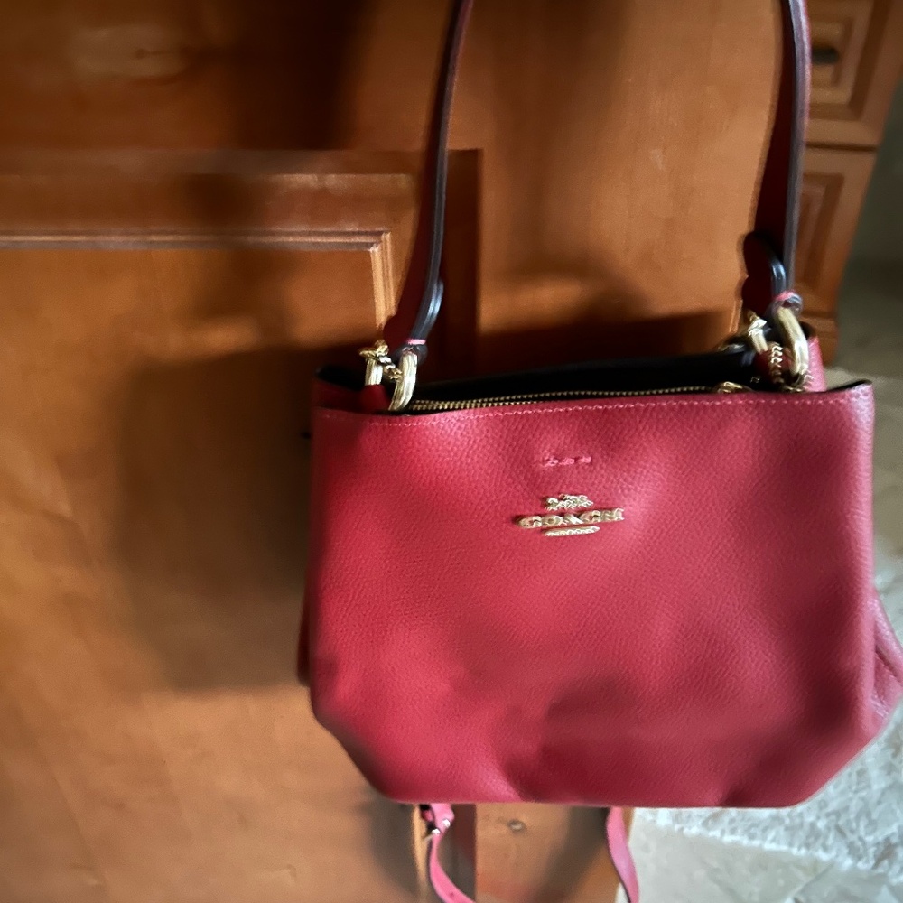 Red Coach brand bucket bag